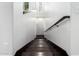 Stairway leading to the upper level, featuring wood steps and a contemporary handrail at 823 W Palo Verde Dr, Phoenix, AZ 85013