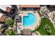 An overhead view of the pristine community pool, featuring ample seating and a landscaped gazebo at 8256 E Arabian Trl # 239, Scottsdale, AZ 85258