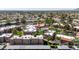 Aerial shot displaying apartment buildings, a communal pool area, and well-maintained lawns in a lush, residential neighborhood at 8256 E Arabian Trl # 239, Scottsdale, AZ 85258