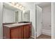 Clean bathroom vanity featuring light fixtures and a large mirror at 8256 E Arabian Trl # 239, Scottsdale, AZ 85258