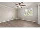 Bright bedroom featuring wood floors, a ceiling fan, and large window at 8256 E Arabian Trl # 239, Scottsdale, AZ 85258