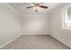 Neutral bedroom with wood-look floors and a ceiling fan at 8256 E Arabian Trl # 239, Scottsdale, AZ 85258