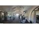 A fitness center with treadmills, weight machines, and a mirrored wall for community residents to utilize at 8256 E Arabian Trl # 239, Scottsdale, AZ 85258