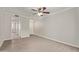 Open living room with wood-look flooring, neutral walls, and a ceiling fan at 8256 E Arabian Trl # 239, Scottsdale, AZ 85258