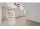 Living room with wood-look floors and sliding glass doors to a balcony at 8256 E Arabian Trl # 239, Scottsdale, AZ 85258