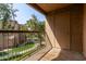 Balcony overlooking a beautifully landscaped green space with mature trees at 8256 E Arabian Trl # 239, Scottsdale, AZ 85258