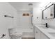 Bright bathroom featuring a toilet, sink and vanity, modern fixtures, and a shower over the tub at 848 W Calle Del Norte --, Chandler, AZ 85225