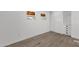 Bedroom featuring wood-look floors, white walls, a double window, and a closet with drawers at 848 W Calle Del Norte --, Chandler, AZ 85225