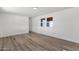 Bedroom featuring wood-look floors, white walls, and a double window providing lots of natural light at 848 W Calle Del Norte --, Chandler, AZ 85225