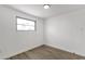 This bedroom features a window and neutral walls with wood-look flooring at 848 W Calle Del Norte --, Chandler, AZ 85225