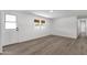 Unfurnished room with wood-look floors, white walls and trim at 848 W Calle Del Norte --, Chandler, AZ 85225