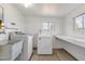 Spacious laundry room with sink, countertops, window, and washer/dryer hookups at 848 W Calle Del Norte --, Chandler, AZ 85225