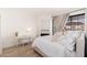 Bright bedroom with wood floors, a cozy fireplace, and a quaint writing desk for a comfortable retreat at 902 W Glendale Ave # 215, Phoenix, AZ 85021
