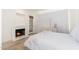 Cozy bedroom with fireplace, access to balcony, and neutral decor, creating a relaxing space at 902 W Glendale Ave # 215, Phoenix, AZ 85021