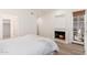 Cozy bedroom with fireplace, access to balcony, and neutral decor, creating a relaxing space at 902 W Glendale Ave # 215, Phoenix, AZ 85021