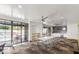 Bright clubhouse area with large table, seating, kitchenette, and access to a pool at 902 W Glendale Ave # 215, Phoenix, AZ 85021