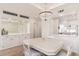 Elegant dining area featuring a chandelier, stylish cabinets and a view into the adjacent kitchen at 902 W Glendale Ave # 215, Phoenix, AZ 85021