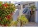 Charming condo featuring lush bougainvillea, palm trees, and modern architecture; located at 215 & 115 at 902 W Glendale Ave # 215, Phoenix, AZ 85021