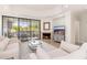 Bright living room features fireplace, balcony access and neutral tones, creating a comfortable atmosphere at 902 W Glendale Ave # 215, Phoenix, AZ 85021