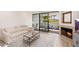 Bright living room features fireplace, balcony access and neutral tones, creating a comfortable atmosphere at 902 W Glendale Ave # 215, Phoenix, AZ 85021