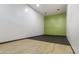 Empty racquetball court featuring a two-tone floor, a green back wall, and white side walls at 902 W Glendale Ave # 215, Phoenix, AZ 85021