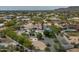 An aerial view showcases the estate's layout, with the pool, sports courts, and lush landscaping at 9053 N 123Rd St, Scottsdale, AZ 85259