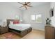 Bright bedroom features a ceiling fan, ample natural light, and wood-look flooring at 9053 N 123Rd St, Scottsdale, AZ 85259