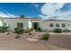 Charming single-story home with desert landscaping, a neutral color palette, and a welcoming front entrance at 9053 N 123Rd St, Scottsdale, AZ 85259