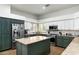 Gourmet kitchen featuring stainless steel appliances and an island with a granite countertop at 9053 N 123Rd St, Scottsdale, AZ 85259