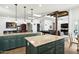 Spacious kitchen featuring an island, granite countertops, and a view of the living area at 9053 N 123Rd St, Scottsdale, AZ 85259