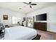 Spacious bedroom with light walls, wood floors, a ceiling fan, and sliding glass doors to backyard at 9053 N 123Rd St, Scottsdale, AZ 85259