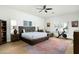Relaxing main bedroom features wood floors, lots of natural light, and exercise equipment at 9053 N 123Rd St, Scottsdale, AZ 85259