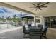 Covered patio offers outdoor seating, a ceiling fan, and a summer kitchen at 9053 N 123Rd St, Scottsdale, AZ 85259