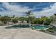 Inviting pool area with mature landscaping, waterfall feature, and comfortable seating at 9053 N 123Rd St, Scottsdale, AZ 85259