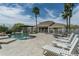 Backyard oasis with a beautiful pool, spa, outdoor kitchen, and plenty of lounging space at 9053 N 123Rd St, Scottsdale, AZ 85259