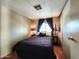 Cozy bedroom featuring a comfortable bed, soft lighting, and ample closet space at 9333 E University Dr # 184, Mesa, AZ 85207