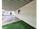 Spacious carport with room for parking and artificial turf area for outdoor enjoyment at 9333 E University Dr # 184, Mesa, AZ 85207