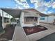 Charming single-story home with well-maintained landscaping and covered parking at 9333 E University Dr # 184, Mesa, AZ 85207