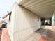 A well-maintained exterior with paved driveway and covered parking, blending functionality with curb appeal at 9333 E University Dr # 184, Mesa, AZ 85207