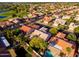 Sprawling neighborhood with neatly lined homes, lush trees, and a golf course offering scenic views at 9717 E Holiday Way, Sun Lakes, AZ 85248