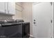 A laundry room featuring modern washer and dryer units at 9717 E Holiday Way, Sun Lakes, AZ 85248