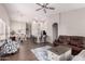 Open-concept living room and kitchen with modern decor and lots of natural light at 9717 E Holiday Way, Sun Lakes, AZ 85248