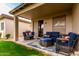 Covered outdoor patio with comfortable blue furniture at 9717 E Holiday Way, Sun Lakes, AZ 85248