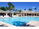Sparkling community pool with ample seating, perfect for relaxation and social gatherings at 9717 E Holiday Way, Sun Lakes, AZ 85248