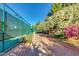 Active lifestyle with this tennis court surrounded by lush landscaping in a vibrant community at 9717 E Holiday Way, Sun Lakes, AZ 85248