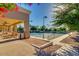 Enjoy a tennis match at the community courts with a covered patio, seating, and shaded views at 9717 E Holiday Way, Sun Lakes, AZ 85248