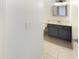 Clean, updated half-bathroom featuring a dark vanity with a white countertop, toilet and modern fixtures at 10101 N 91St Ave # 162, Peoria, AZ 85345