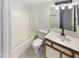 Bright bathroom featuring a shower-tub combo, modern vanity with a white countertop and toilet at 10101 N 91St Ave # 162, Peoria, AZ 85345
