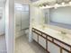 Bright bathroom with double sinks and a shower over bath at 10101 N 91St Ave # 162, Peoria, AZ 85345