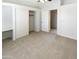 A bright bedroom with neutral carpet, a ceiling fan, and a double closet at 10101 N 91St Ave # 162, Peoria, AZ 85345
